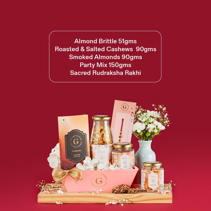 Image of THE GIFT STUDIO.COM | Rudraksha Bliss Rakhi Hamper for Brother | Rudraksha Rakhi, Almond Brittle, Roasted Cashews, Smoked Almonds & Party Mix | Rakhi Gift Hamper