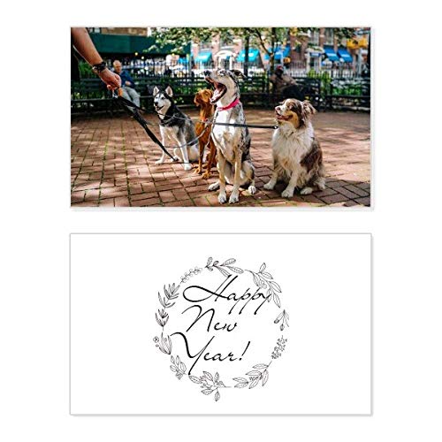 Tarjeta conmemorativa de Año Nuevo con adorables perros para emocionar a tus seres queridos