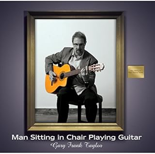 Man Sitting in Chair Playing Guitar