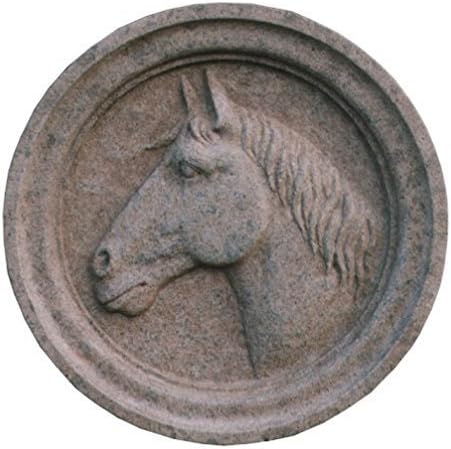 Hight relief profile of a horse carved on grey peperino stone.