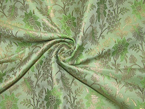 Tissu brocart vert et doré métallique pour coudre une robe de soirée