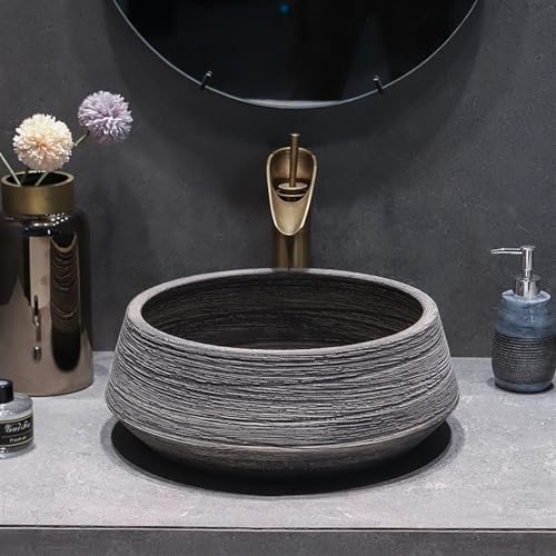 Lavabo artístico redondo de cerámica que soluciona salpicaduras en baños 6