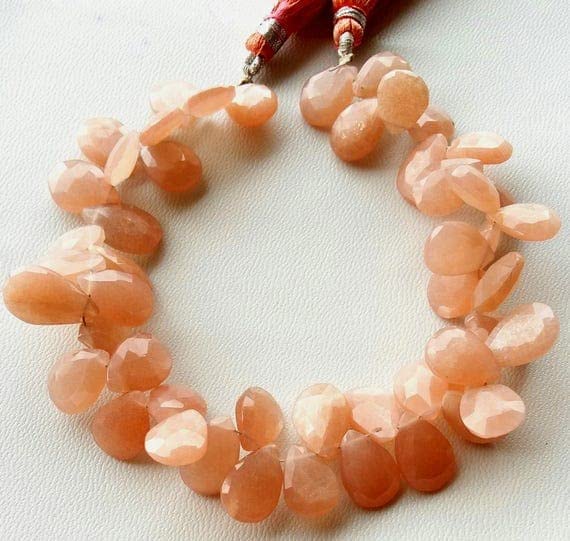 Pierre de lune pêche facettée haut de gamme pour création bijoux fins