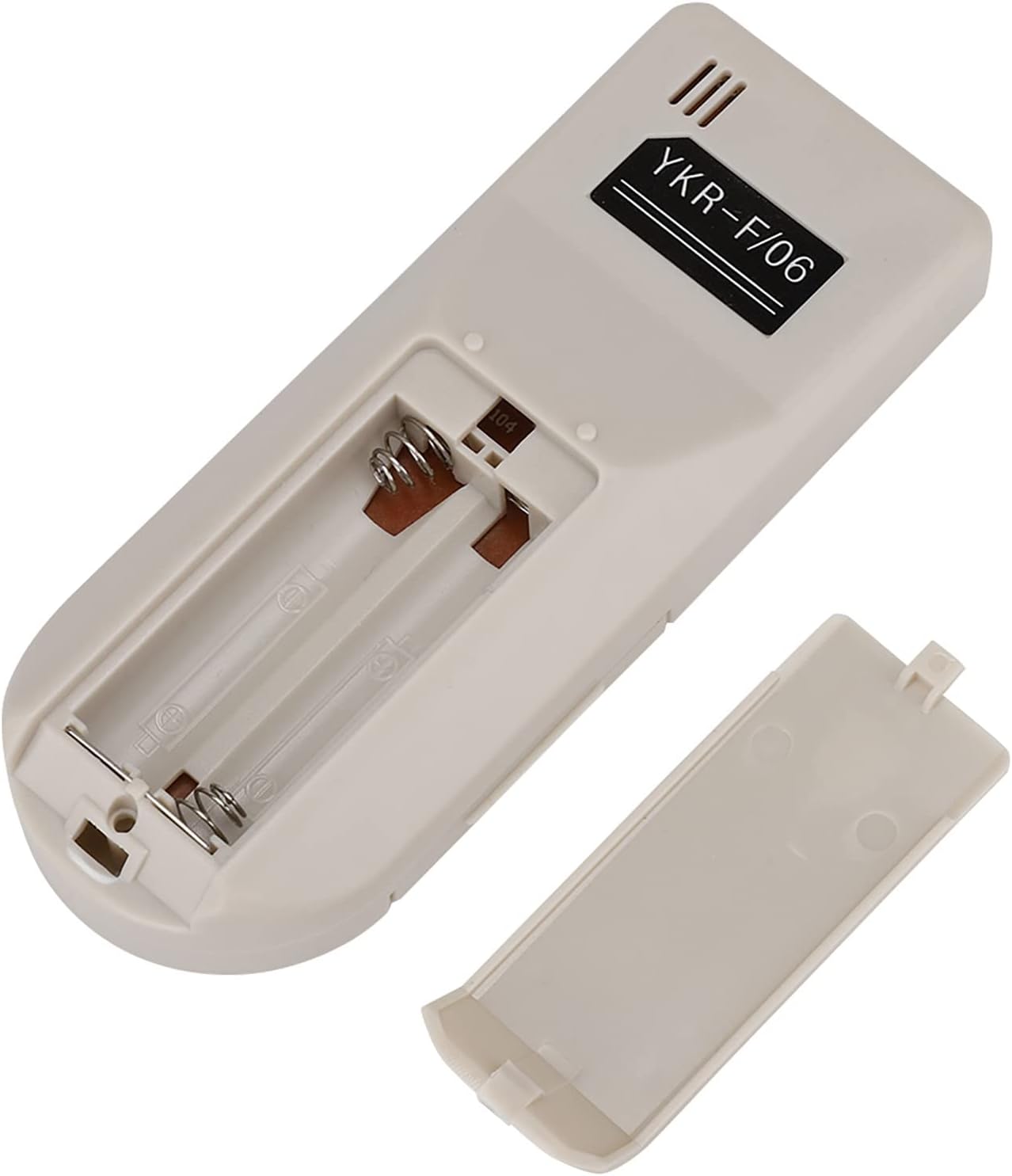 Close-up image of the Yunir YKR-F/06 remote control's open battery compartment, showing the terminals for AAA batteries.