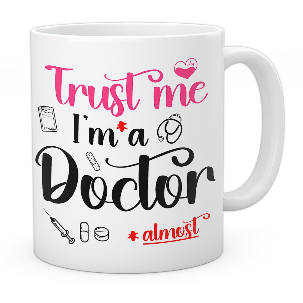 EnvyFone Trust ME I'm Almost a Doctor - Funny Doctors or Junior Doctors Gift - Novelty Tea Coffee Ceramic Cup (Pink)