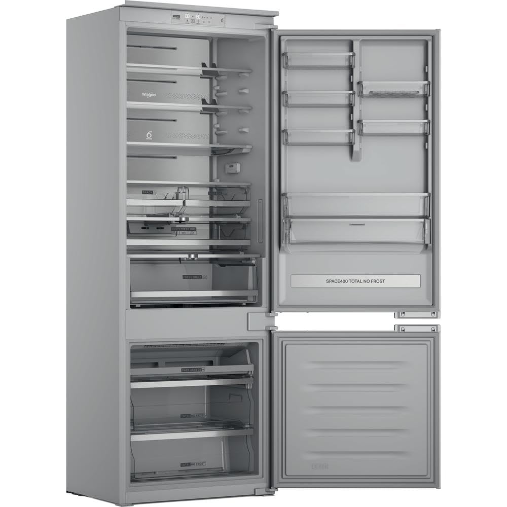 Whirlpool WH SP70 T262 P built-in refrigerator with doors open, revealing spacious interior compartments.