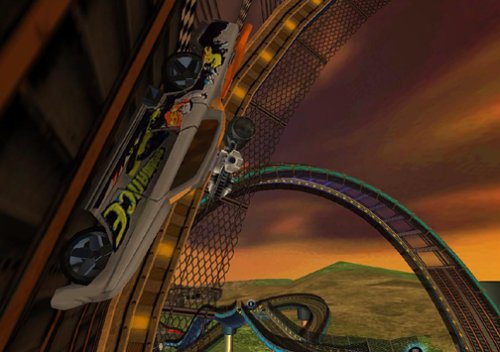 Gameplay screenshot of a white Hot Wheels car with flames on the side, driving on a track with a sunset background.