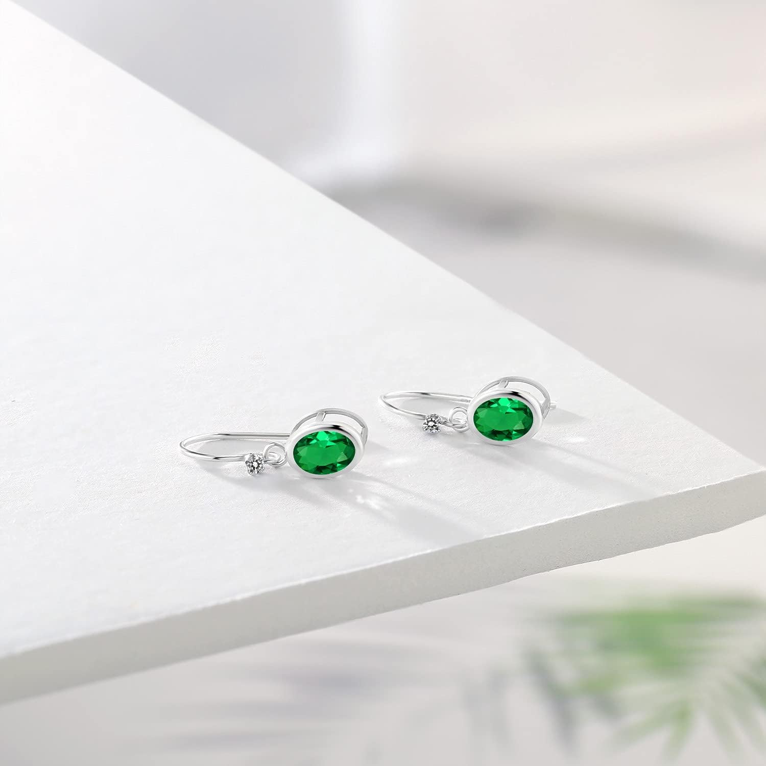 Gem Stone King 925 Sterling Silver Green Nano Emerald and White Diamond French Wire Earrings For Women (1.22 Cttw, Gemstone May Birthstone, Oval 7X5MM, Round 1.25MM)