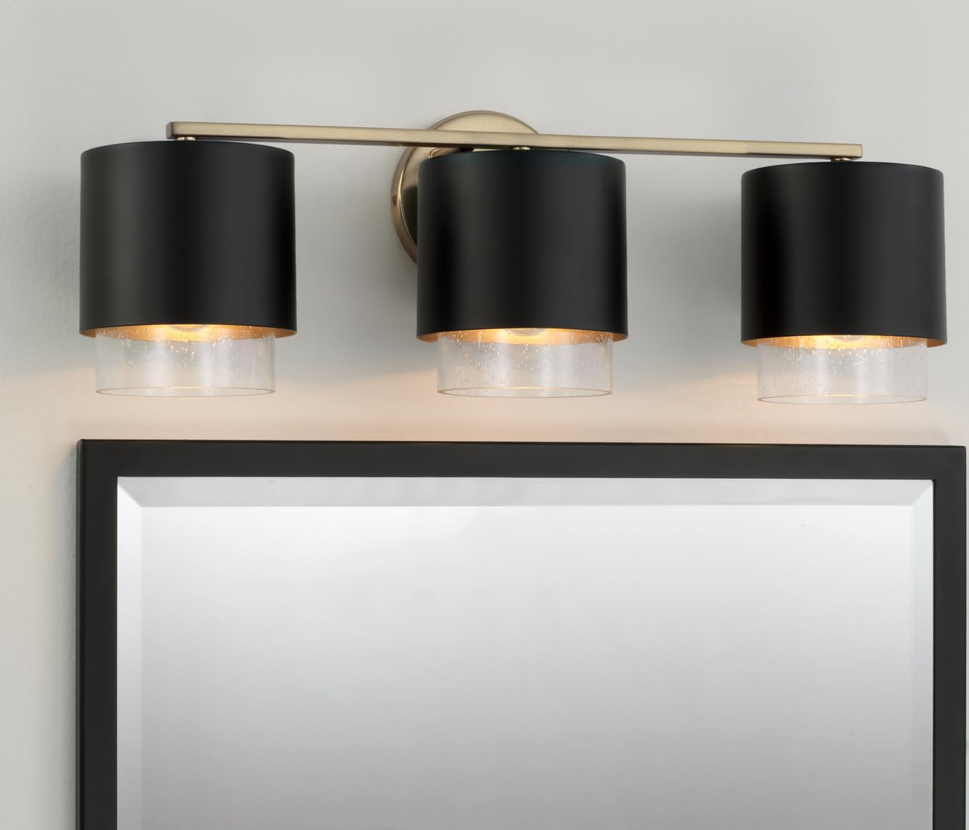 Capital Lighting 153031RK-549 Weller Modern Clear Seeded Glass/Black Metal Dual Shade Cylindrical Bathroom Vanity, 3-Light 300 Total Watts, 8" H x 24" W, Matte Brass