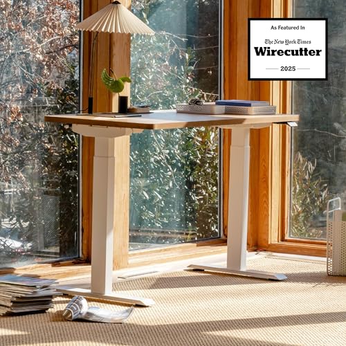 Image of Branch Duo Standing Desk, Adjustable Standing Desk with 20 inch Range | OLED Control Panel, Frameless Design and Compact Size Suitable for Many Spaces, 48 Inches, Woodgrain Base, White Top