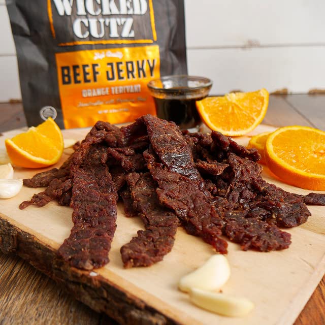 Miniatura 7 de Wicked Cutz - Cecina de Res Teriyaki Naranja, 24g de Proteína por Bolsa, Alternativa Tierna y Fácil de Masticar a las Palitos de Res Teriyaki,