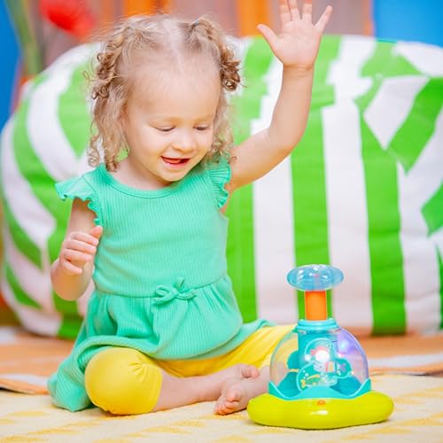 Bright Starts, 10042 Press & Glow Spinner, Musikspielzeug Kreisel mit blinkenden Lichtern und Melodien, fördert die Motorik und das Verstehen von Ursache und Wirkung, 19.05 x 17.78 x 21.59 cm