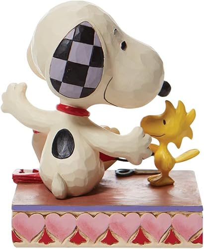 Miniatura 3 de Enesco Colección Peanuts de Jim Shore Woodstock y Snoopy con guirnalda de corazón, figura de resina de piedra, hecha a mano, pintada a mano, figuras