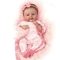This lifelike baby doll is handcrafted with soft, RealTouch® vinyl skin that is handpainted to highlight every darling detail Soft, hand-rooted brown hair adds even more realism to this So Truly Real® doll Her cuddly cloth body is poseable and weight...