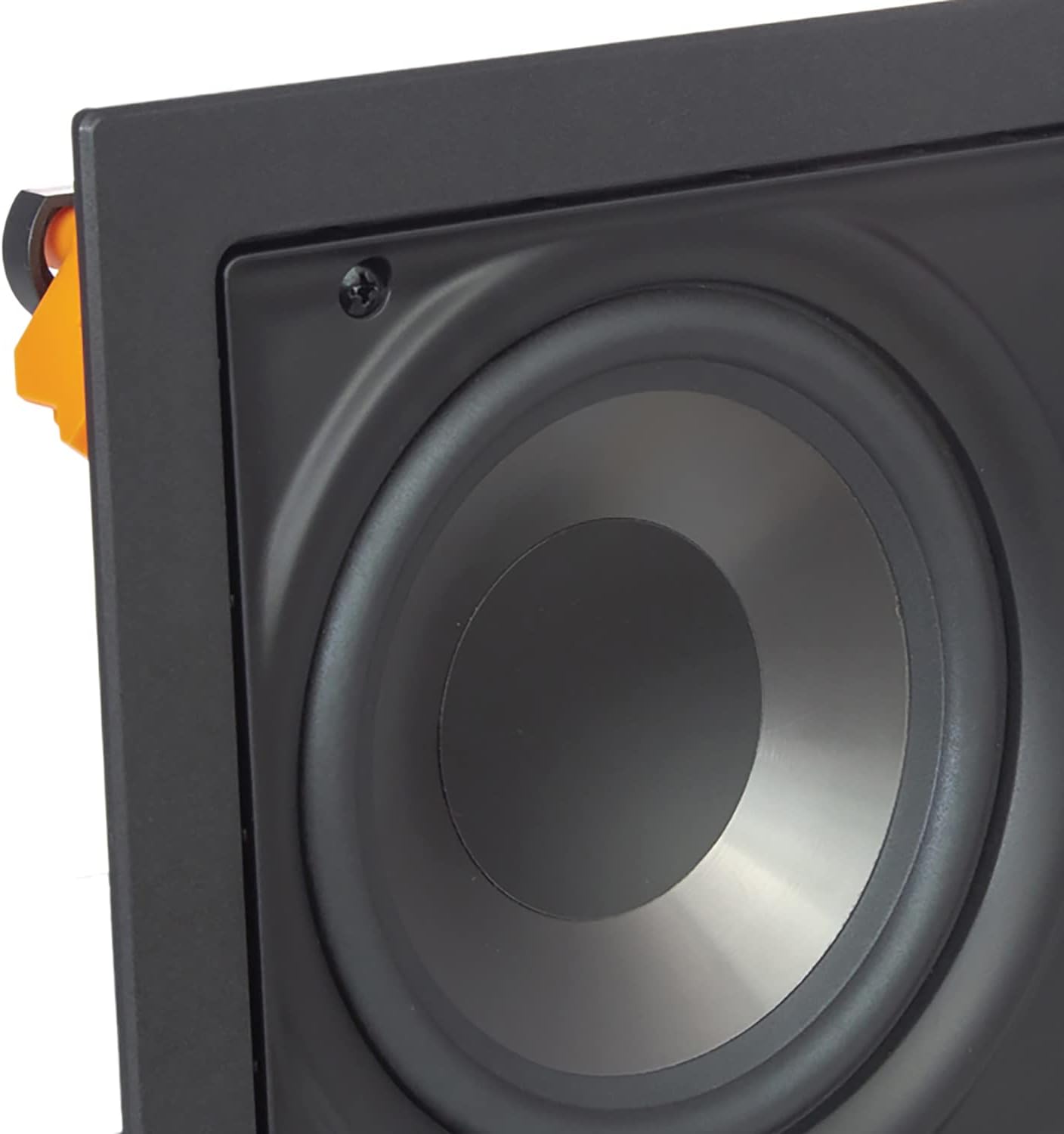 Primer pla view of the SpeakerCraft SC-DX-FW5-LCR speaker's woofer and a visible orange mounting clamp on the side, indicating the in-wall installation mechanism.