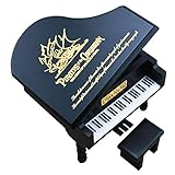 Material: piano de madera y movimiento musical de metal