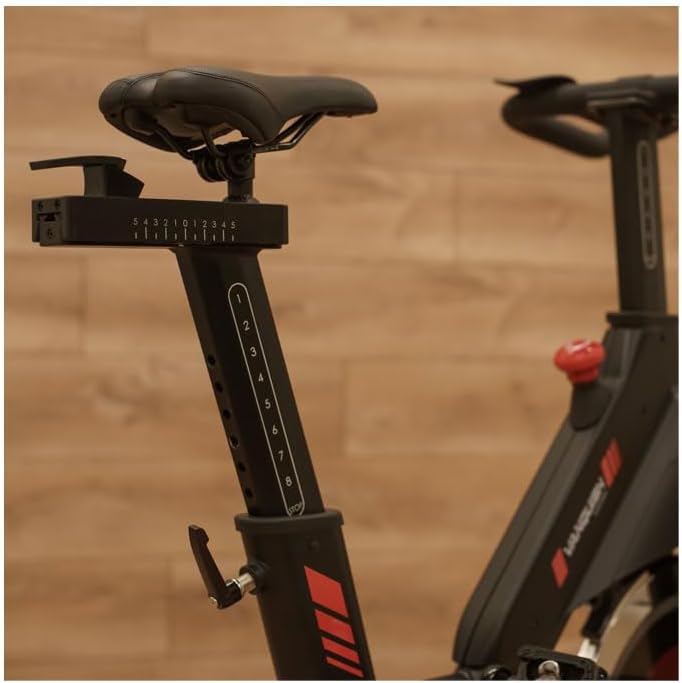 Close-up of the seat post and horizontal adjustment mechanism on the BH Vanquish Indoor Cycling Bike.