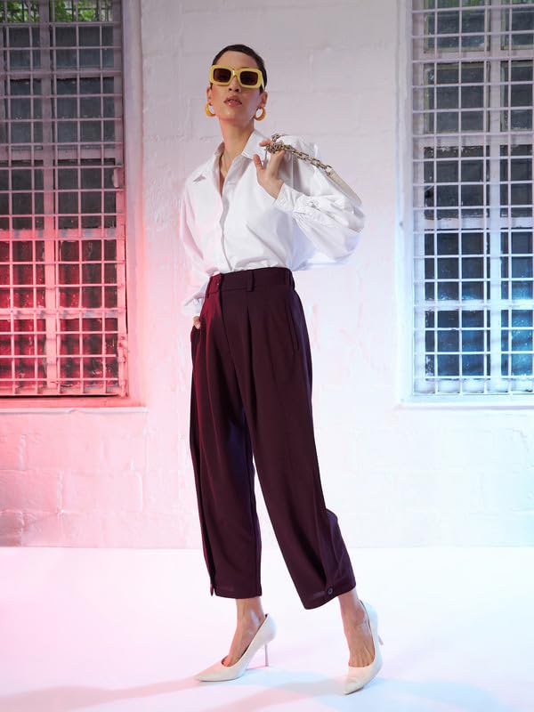 Image of SASSAFRAS Burgundy Button Hem Darted Balloon Pants
