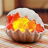 Die besondere Form der Tischlampe macht das warme und warme Licht romantischer nach dem Einschalten der Leuchten