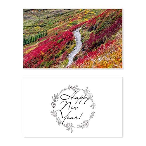 Tarjeta conmemorativa con paisaje forestal colorido y emotivos deseos de año nuevo