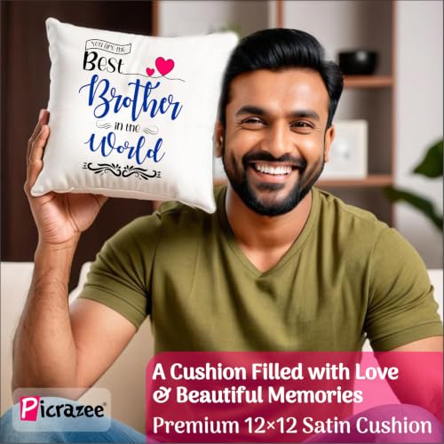 Image of PICRAZEE Raksha Bandhan Gift for Brother - Rakhi, 12 inch Cushion with Filler, Mug, Table Standy, Roli-Chawal Bottles, Keyring, Fridge Magnet & Greeting Card (Best Brother)