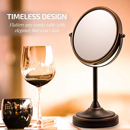 Image of OVENTE 7'' Tabletop Makeup Mirror with 1X /7X Magnification, 360 Swivel Design and Double-Sided Free-Standing Vanity Mirror Perfect for Dresser, Bedroom and Office Desk, Antique Bronze MNLCT70ABZ1X7X