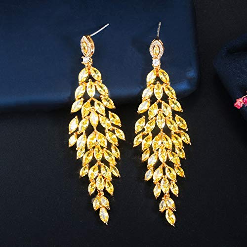 Boucles d'oreilles pendantes longues en zircon jaune, le secret d'un visage illuminé