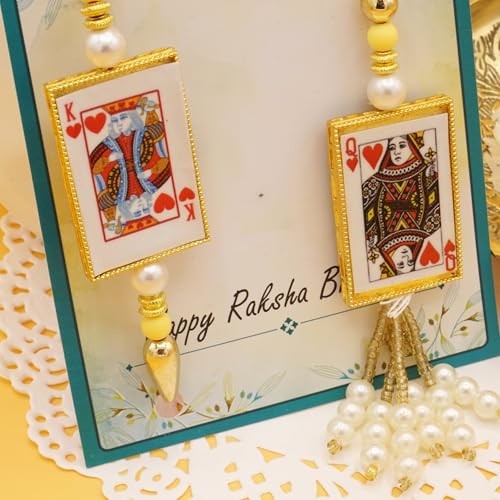 UtsaWe Rakhi Gift Box | Rakhi Gift Hamper made with a King Bhaiya and Queen Bhabhi Rakhi, Roli, Chaval, Mini Thali Set, Greeting Card, and Chocolates | Lumba Rakhi | Bhaiya Bhabhi Rakhi Set (Bhaiya Bhabhi Rakhi Set 4)3