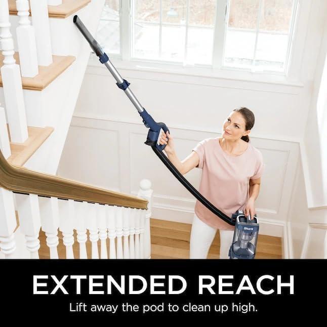 Woman using the extended reach wand to clean high areas