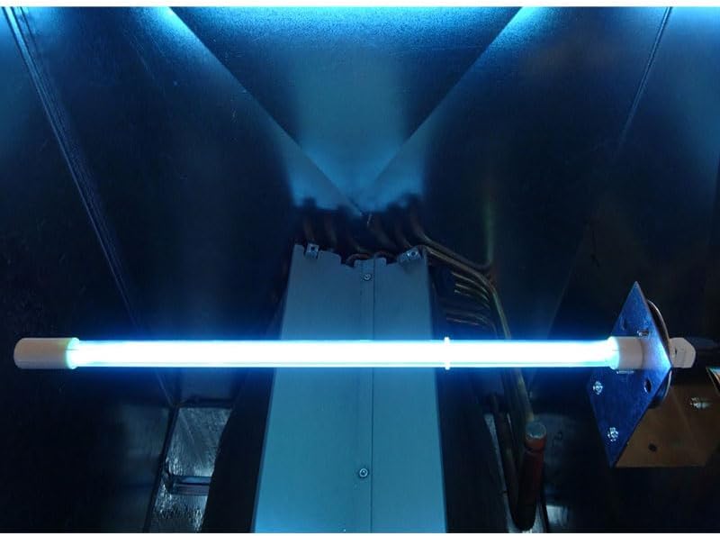 Sanuvox UV lamp installed and illuminated inside an air duct, emitting a blue light.