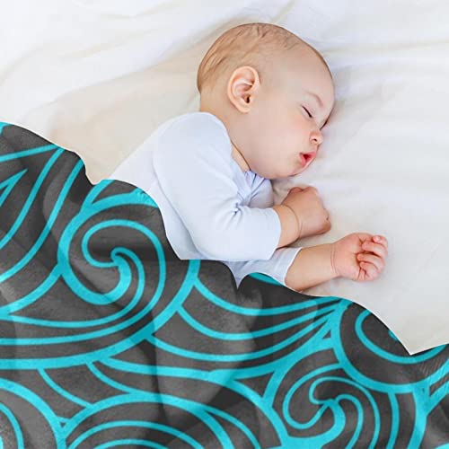 Couverture douce motif vagues pour cocooning sur canapé et voyage