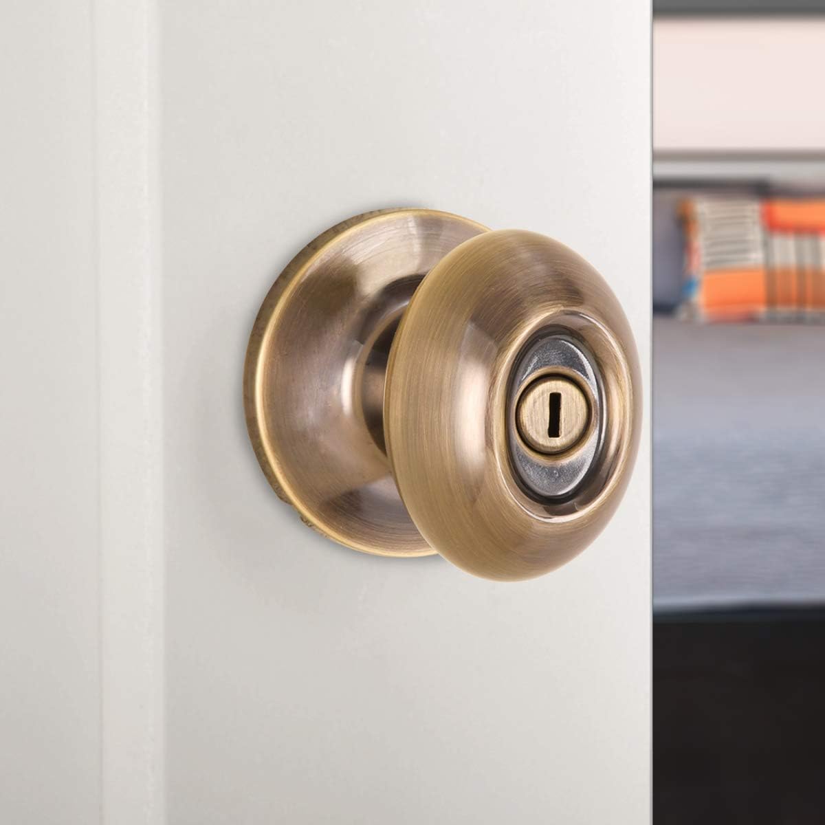 Amazon Basics Bedroom/Bathroom Door Knob With Lock, Oval Egg, Antique Brass