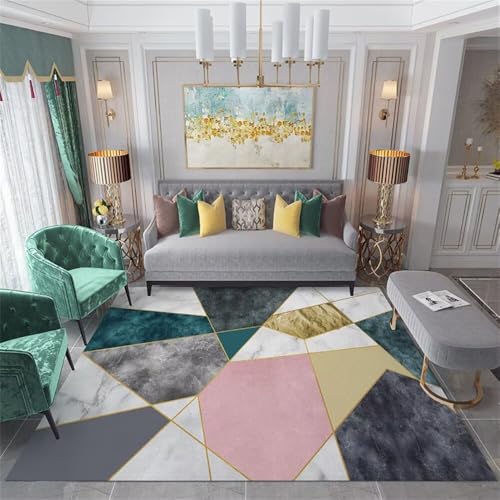 Petit canapé chambre ado complété par un tapis doux géométrique