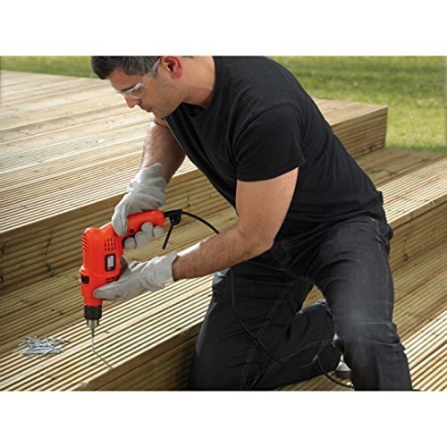 Man drilling into a wooden surface with BLACK+DECKER KR504RE