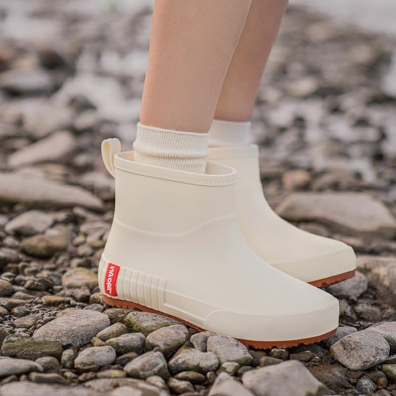 Women's fashionable short boots with flat round toe and PVC upper. Comfortable and slip-resistant. Suitable for outdoor and kitchen work.