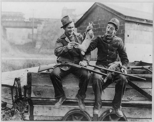 HistoricalFindings Photo: Men Seated on a Wagon Holding Rabbits