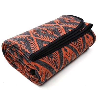 Folded PuTian Merino Wool Blanket with a orange bohemian pattern. 