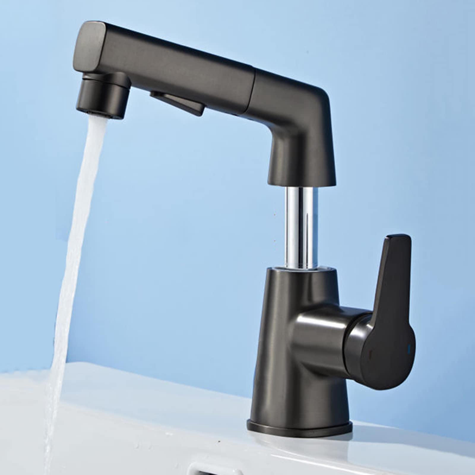 Mitigeur de lavabo avec douchette mobile pour faciliter le lavage des cheveux dans la salle de bain