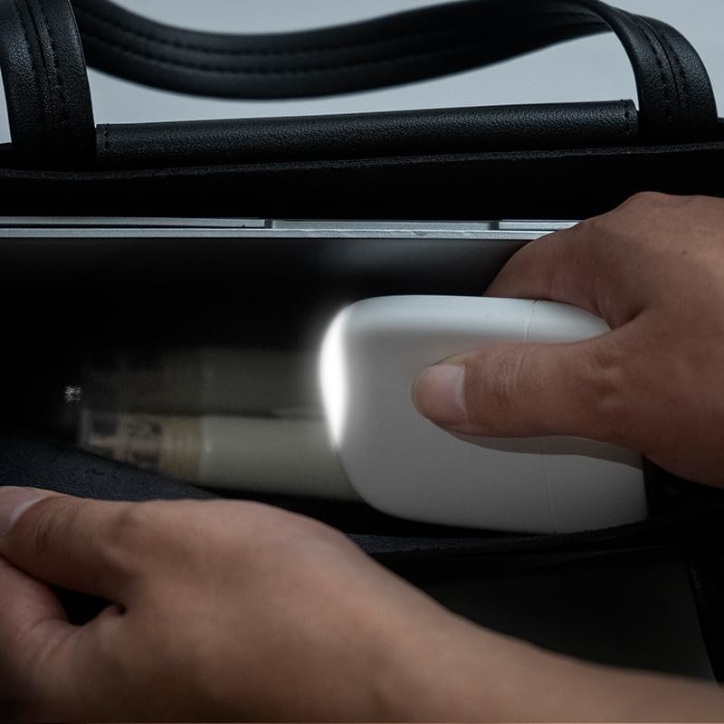 Xoopar Ice-Powerbank being placed into a bag, demonstrating its portability and ease of storage.