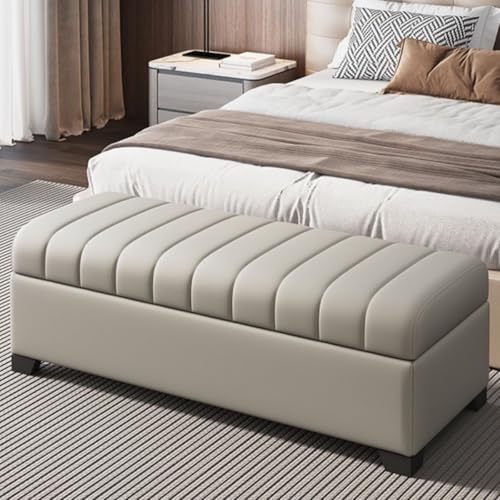 Pouf de chambre gris clair et meuble de rangement pour chaussures