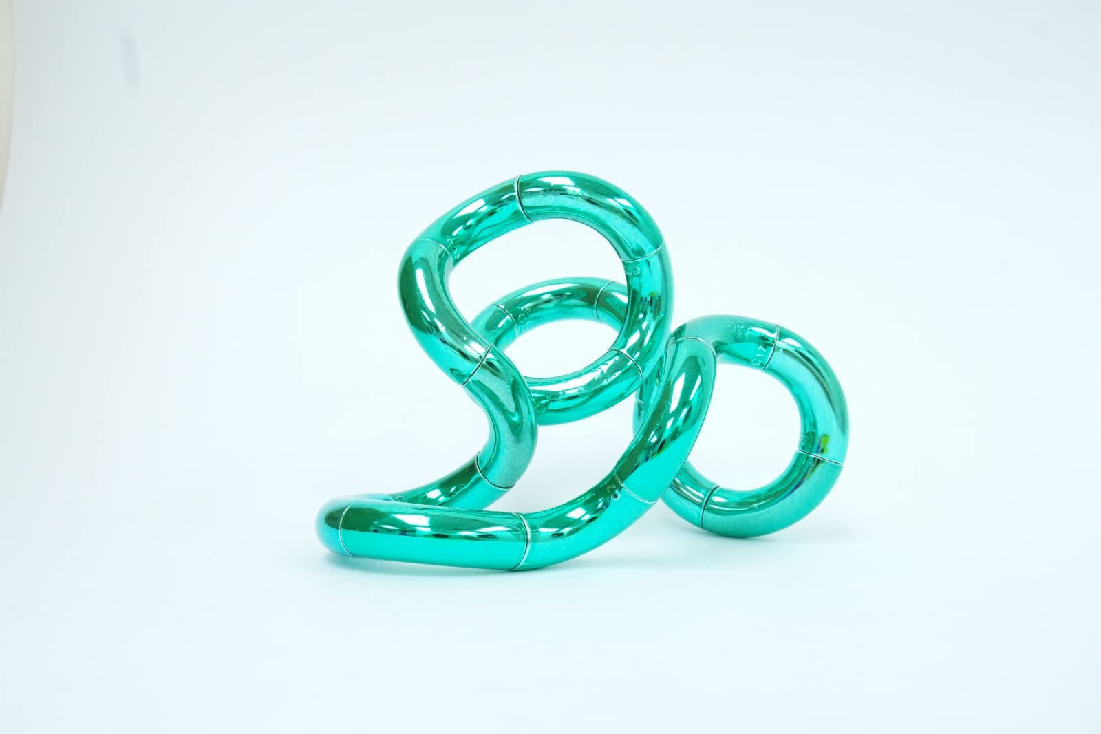 Tangle 85218 Fidget Toy Junior Metallic Series, Anti-Stress Finger Toy, Promotes Coordination and Fine Motor Skills, Can Be Turned and Combined, Motor Skills Toy for Children from 3 Years, Emerald