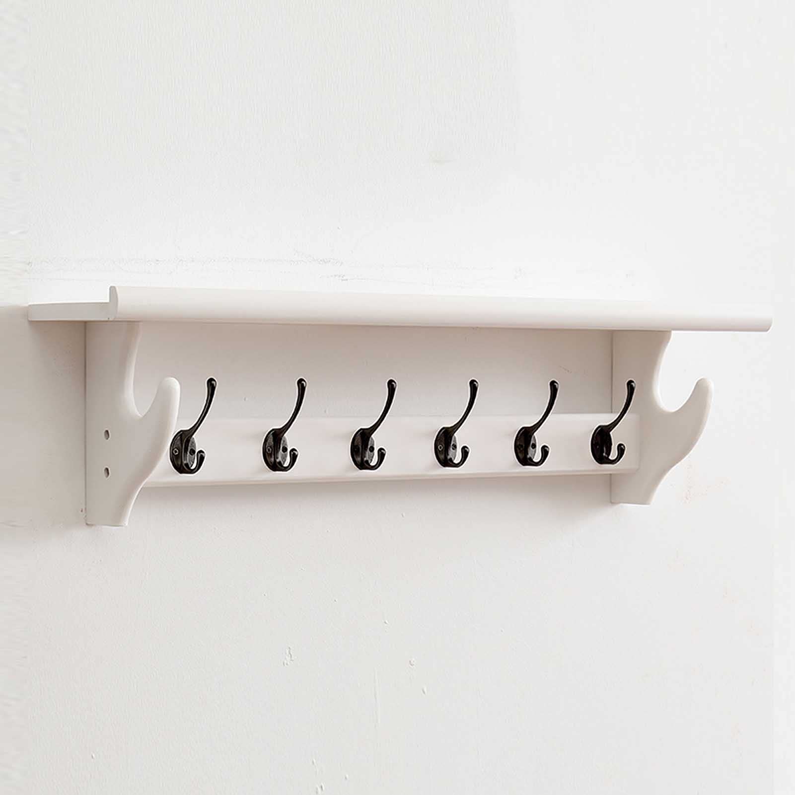 Tringle à vêtements murale pour optimiser l'entrée avec étagère en bois suspendue