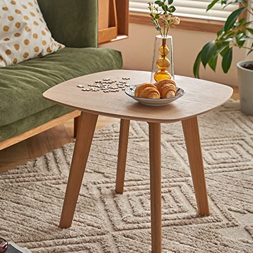 Petite table basse ronde en bois massif avec pieds robustes