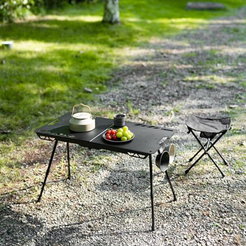 Table portable avec pieds rétractables pour stabiliser vos repas extérieurs