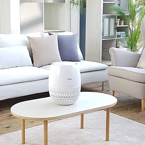 Clair Hc Air Purifier positioned on a coffee table in a living room setting
