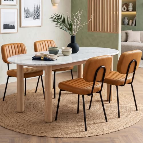 Four brown upholstered mid century dining chairs with metal legs and shell-shaped backs — the full-size option that seats children at the family table