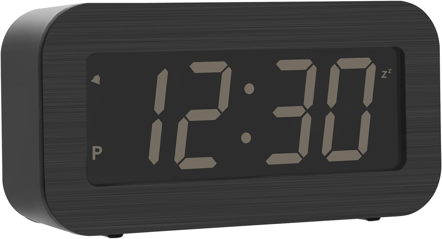 Digital alarm clock showing switchable LCD and LED displays