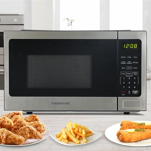 Farberware 0.9 Cu. Ft. Countertop Microwave Oven – 900 Watts Power, Auto Cook Settings, Defrost, Easy Clean and Child Safety Lock - Stainless by Farberware - Used condition - Image 6
