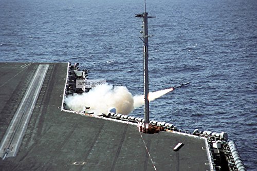 Photo A North Atlantic Treaty Organization (NATO) RIM-7M Sea Sparrow radar-guided, air-to-air missile is fired from the Mk 29 Guided Missile Launching System (GMLS) onboard the US Navy (USN) Aircraft Carrier USS George Washington (CVN 73) during a live fire launch exercise. The Washington is completing a regularly scheduled deployment in support of Operation ENDURING FREEDOM, 06/21/2002