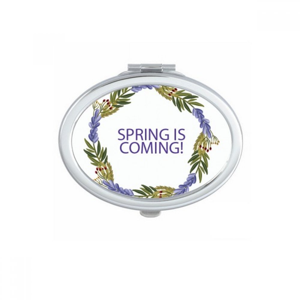 Miroir de maquillage compact portable fleur bleue ovale et ergonomique pour retouches express